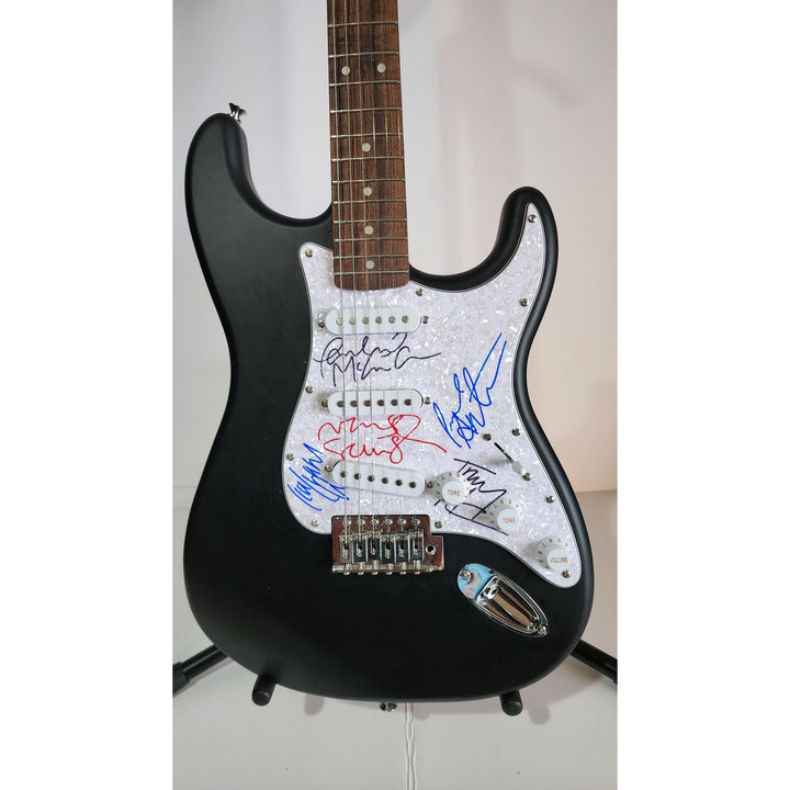 Oasis: Noel & Liam Gallagher, Fender Stratocaster electric guitar signed with proof