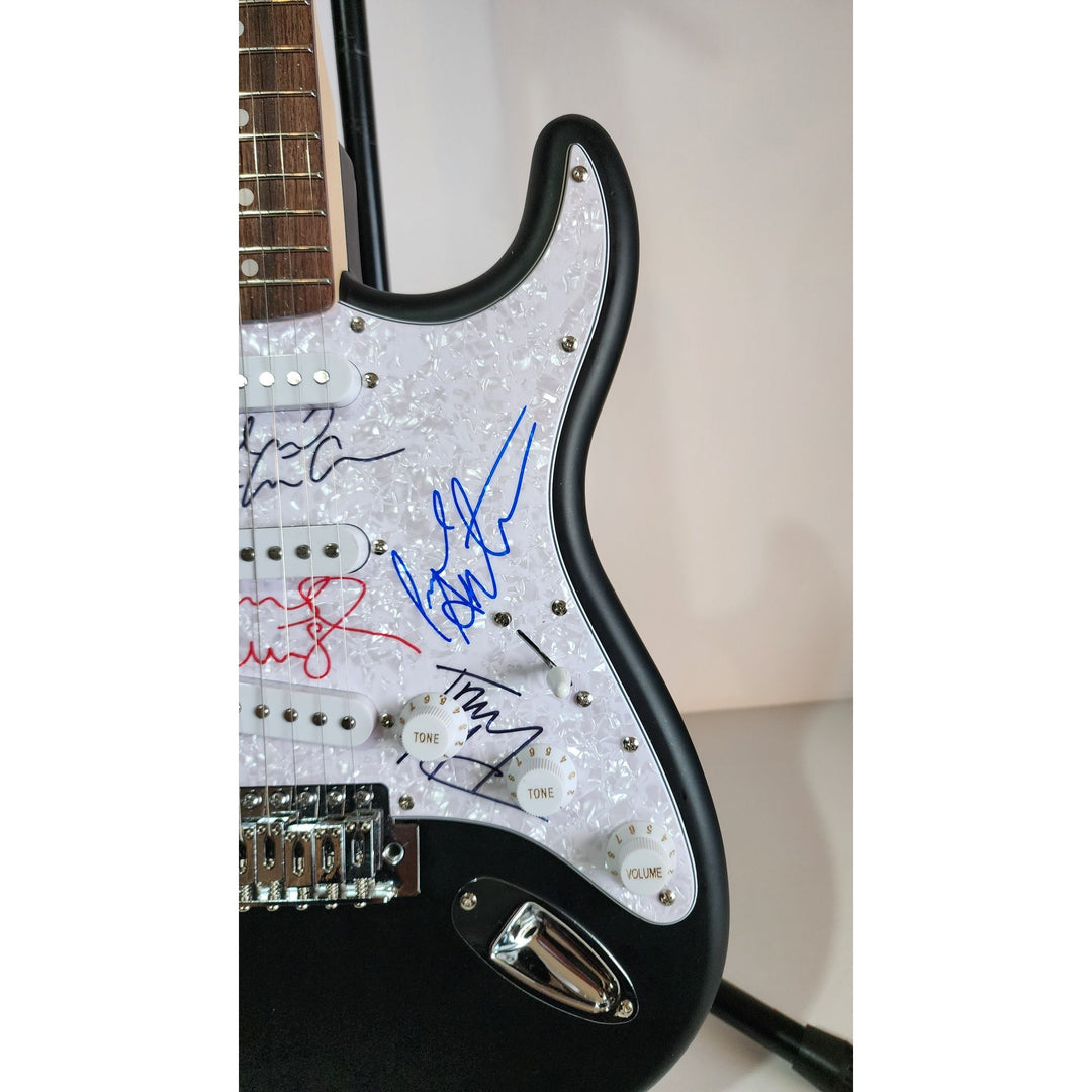 Oasis: Noel & Liam Gallagher, Fender Stratocaster electric guitar signed with proof