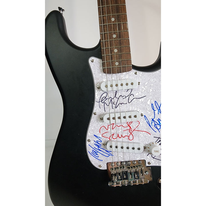 Oasis: Noel & Liam Gallagher, Fender Stratocaster electric guitar signed with proof