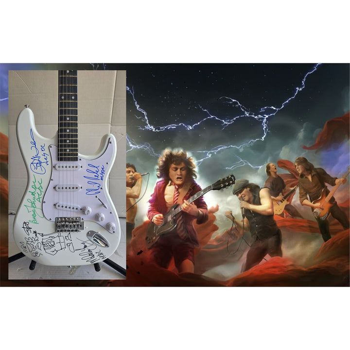Angus & Malcolm Young, Brian Johnston, Phil Rudd, Cliff Williams AC/DC Fender Stratocaster electric guitar signed with proof.