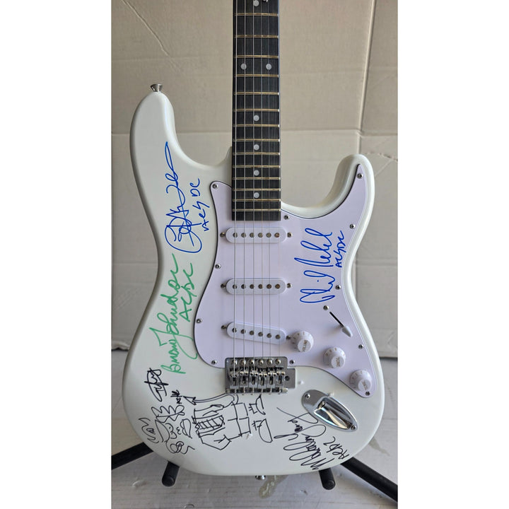 Angus & Malcolm Young, Brian Johnston, Phil Rudd, Cliff Williams AC/DC Fender Stratocaster electric guitar signed with proof.