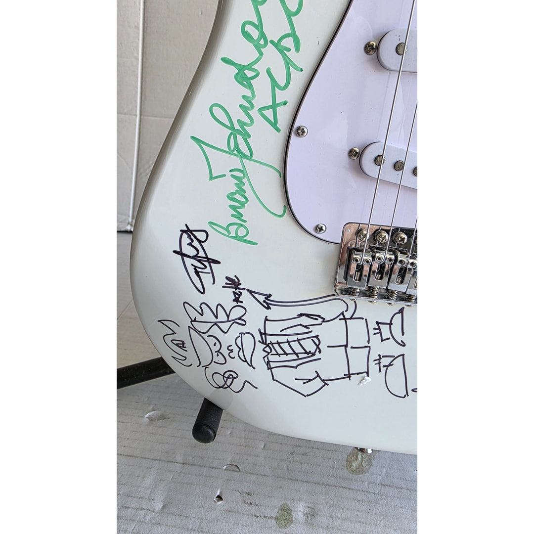 Angus & Malcolm Young, Brian Johnston, Phil Rudd, Cliff Williams AC/DC Fender Stratocaster electric guitar signed with proof.