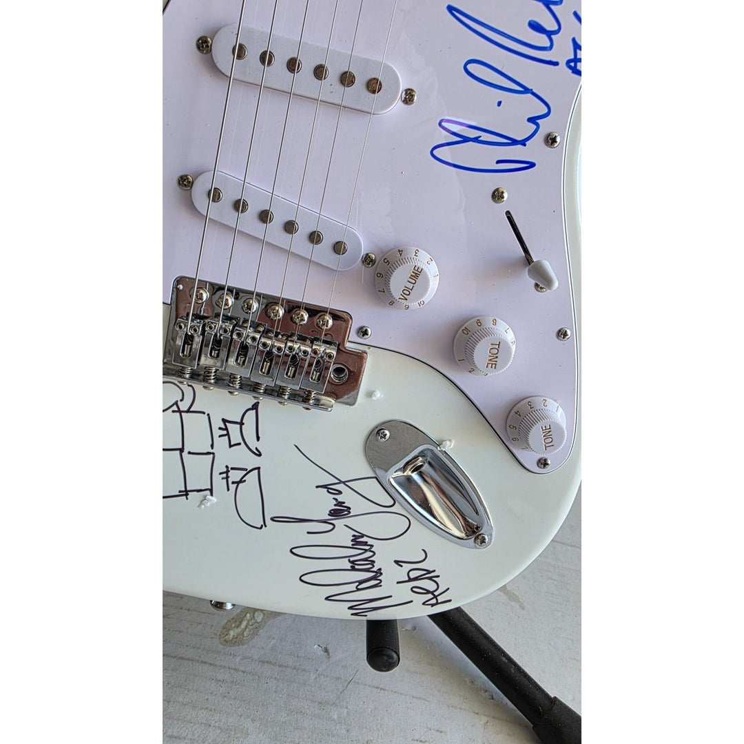 Angus & Malcolm Young, Brian Johnston, Phil Rudd, Cliff Williams AC/DC Fender Stratocaster electric guitar signed with proof.