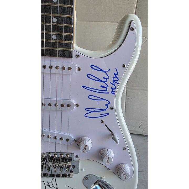 Angus & Malcolm Young, Brian Johnston, Phil Rudd, Cliff Williams AC/DC Fender Stratocaster electric guitar signed with proof.