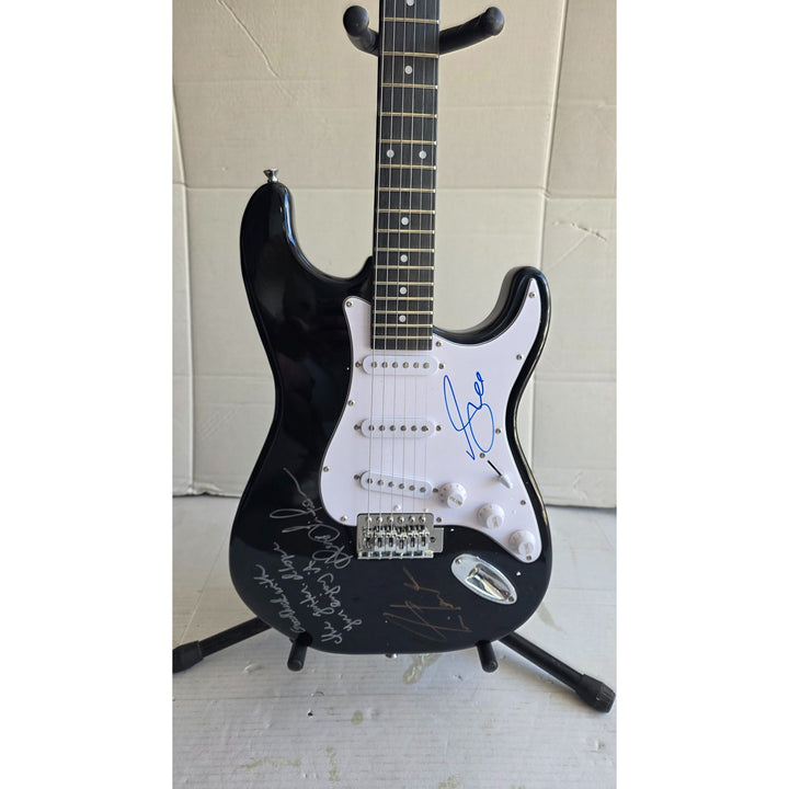 Geddy Lee Alex Lifeson Neil Peart Rush Stratocaster electric guitar signed with proof.