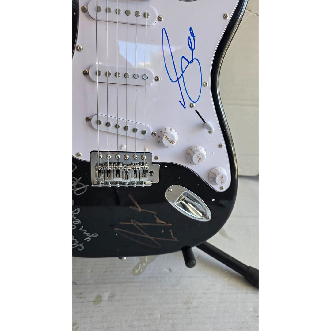 Geddy Lee Alex Lifeson Neil Peart Rush Stratocaster electric guitar signed with proof.