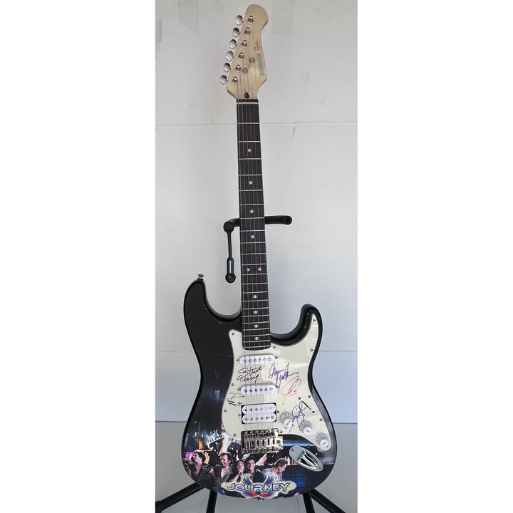 Neal Schon,  Ross Valory,  Jonathan Cain, Greg Rowley Steve Perry Journey band signed electric guitar with proof.