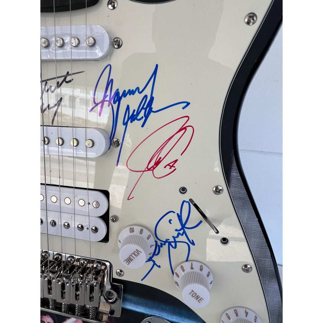 Neal Schon,  Ross Valory,  Jonathan Cain, Greg Rowley Steve Perry Journey band signed electric guitar with proof.