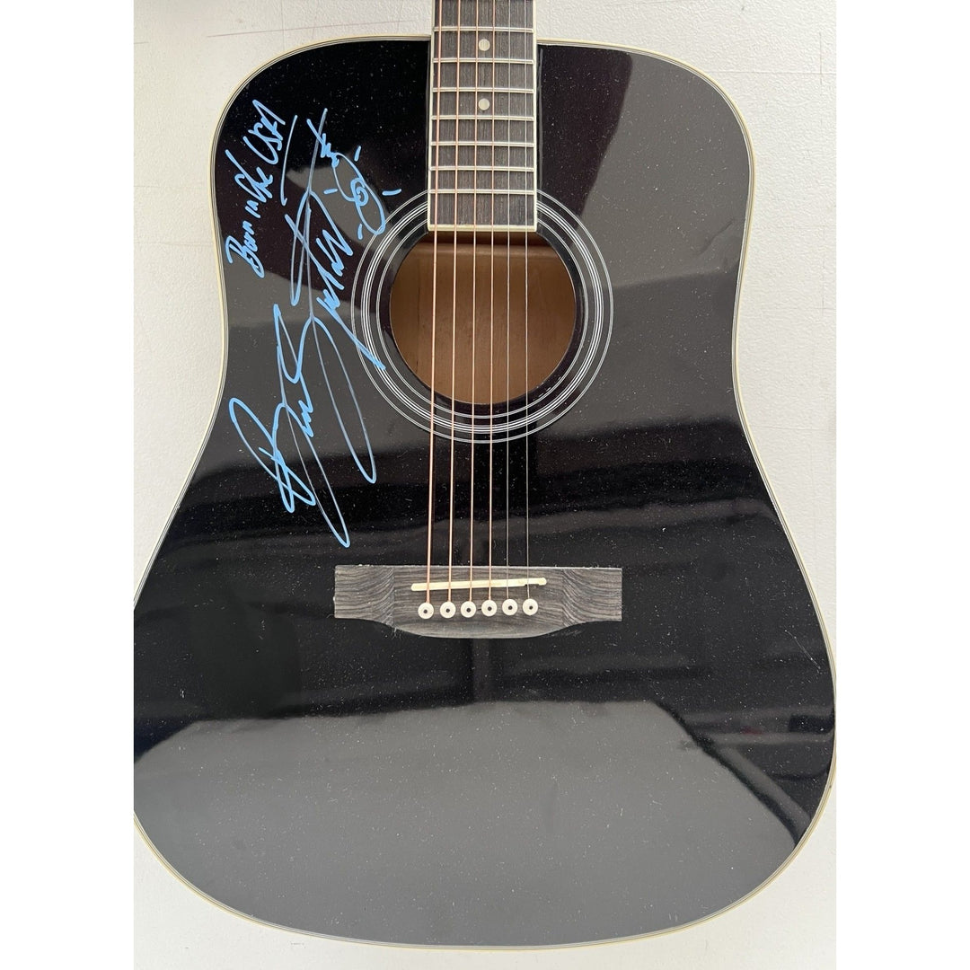 Bruce Springsteen full size black acoustic guitar signed with proof.