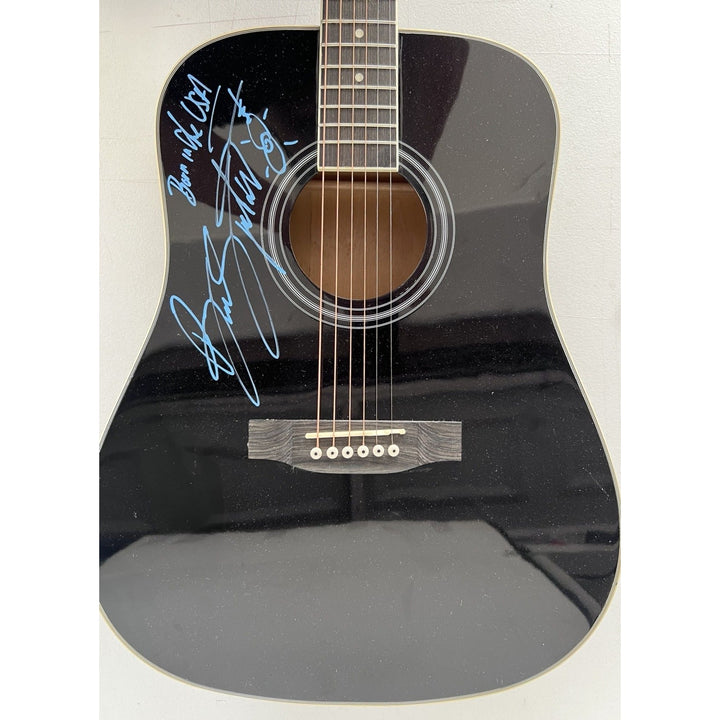 Bruce Springsteen full size black acoustic guitar signed with proof.