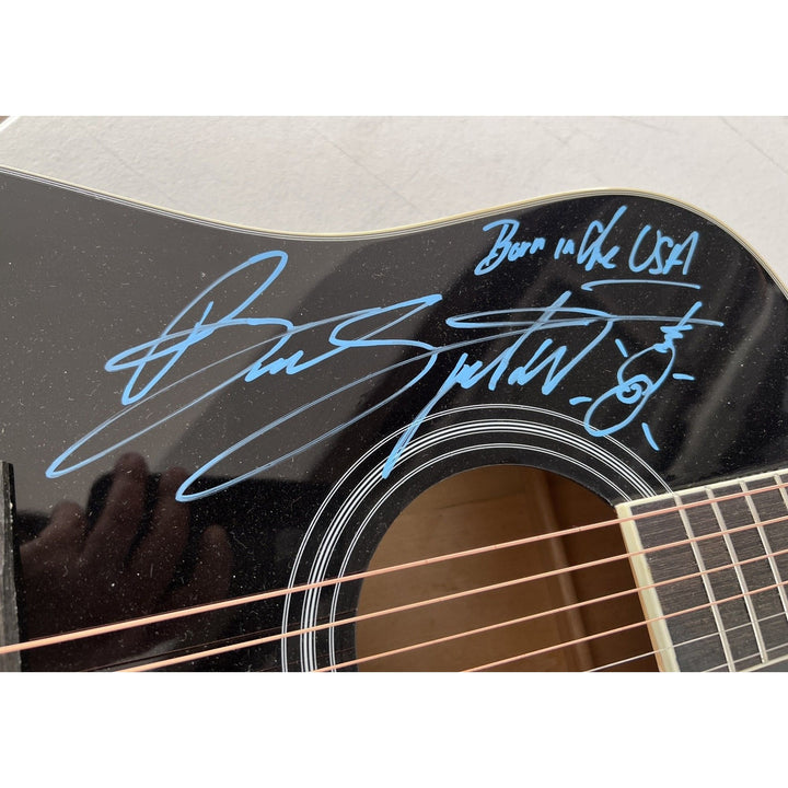 Bruce Springsteen full size black acoustic guitar signed with proof.