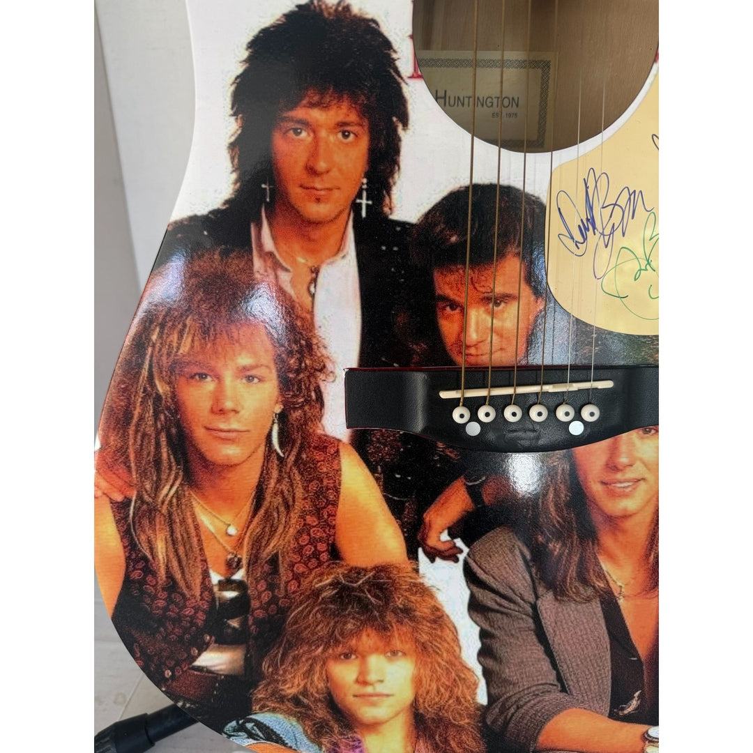 Jon Bon Jovi, Richie Sambora, Tico Torres, David Bryan Bon Jovi one of a kind acoustic guitar signed with proof.