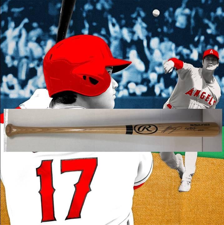 Baseball player in red helmet, number 17, with a bat and pitcher in the background.