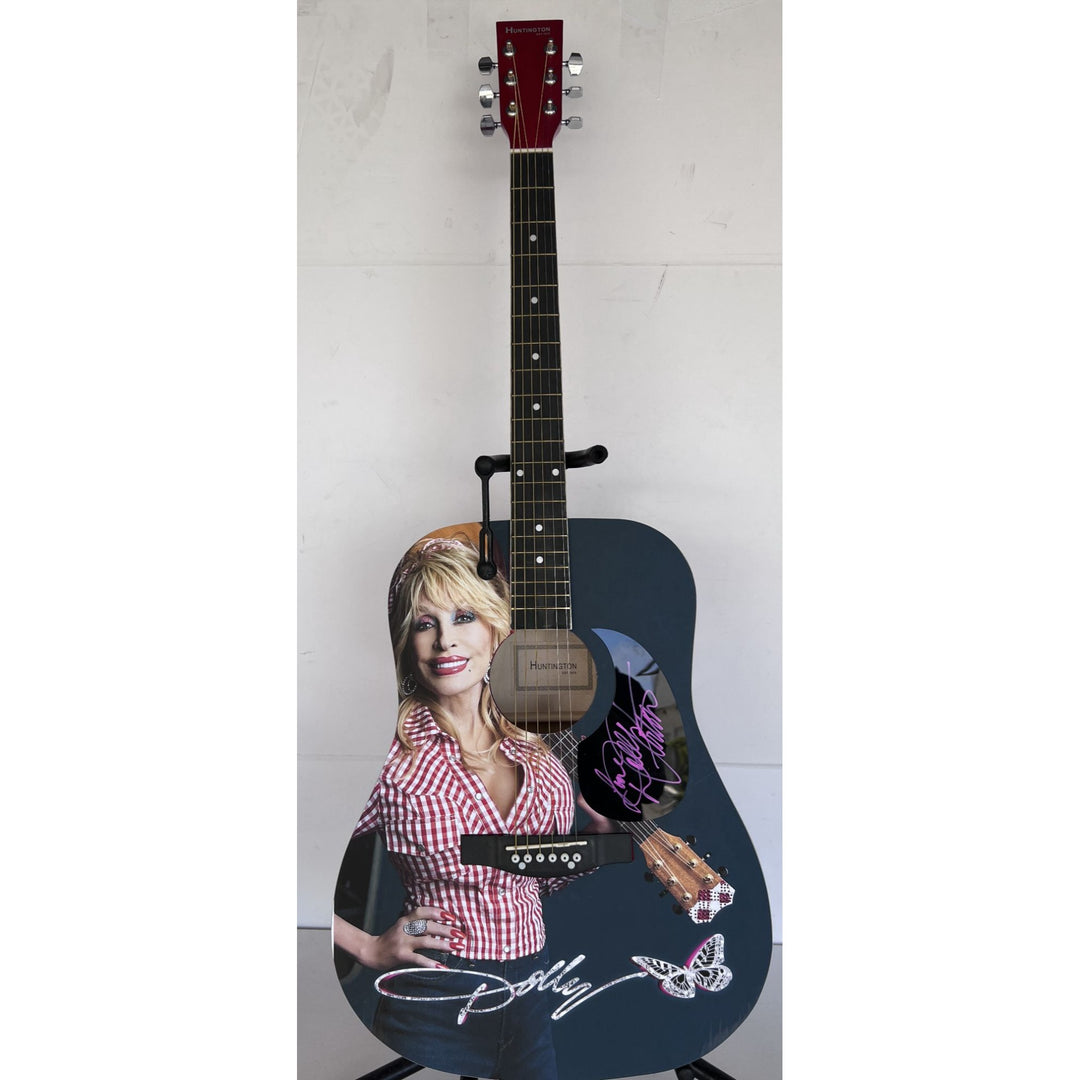Dolly Parton full size acoustic guitar (one of a kind ) signed with proof .