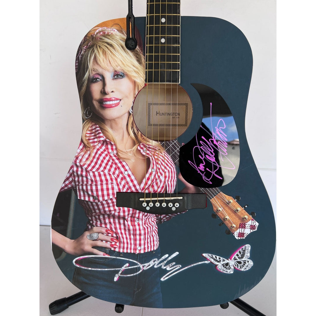 Dolly Parton full size acoustic guitar (one of a kind ) signed with proof .