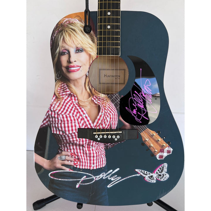 Dolly Parton full size acoustic guitar (one of a kind ) signed with proof .