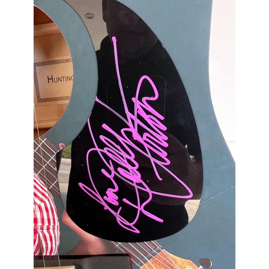 Dolly Parton full size acoustic guitar (one of a kind ) signed with proof .