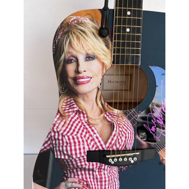 Dolly Parton full size acoustic guitar (one of a kind ) signed with proof .