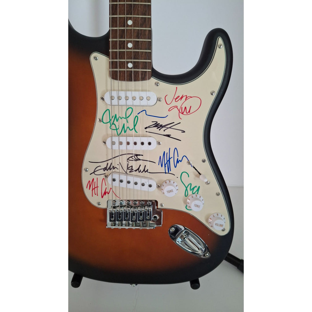 Pearl Jam, Eddie Vedder, Stone Gossard, Matt McCready, Matt Cameron, Jeff Amen, Fender Stratocaster Squier electric guitar signed with proof