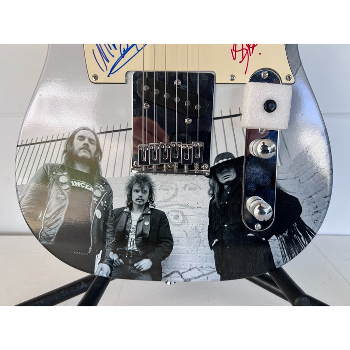 Lemmy Kilmister, guitarist Larry Wallis and drummer Lucas Fox Motörhead "One of a Kind" telecaster full size electric guitar signed.