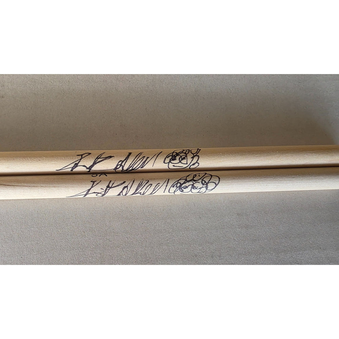 Rick Allen Def Leppard legendary drummer pair of drumsticks signed with proof.