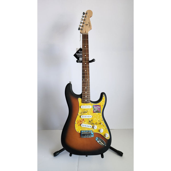 Cream, Eric Clapton, Ginger Baker, Jack Bruce, authentic Fender Stratocaster electric guitar signed with proof