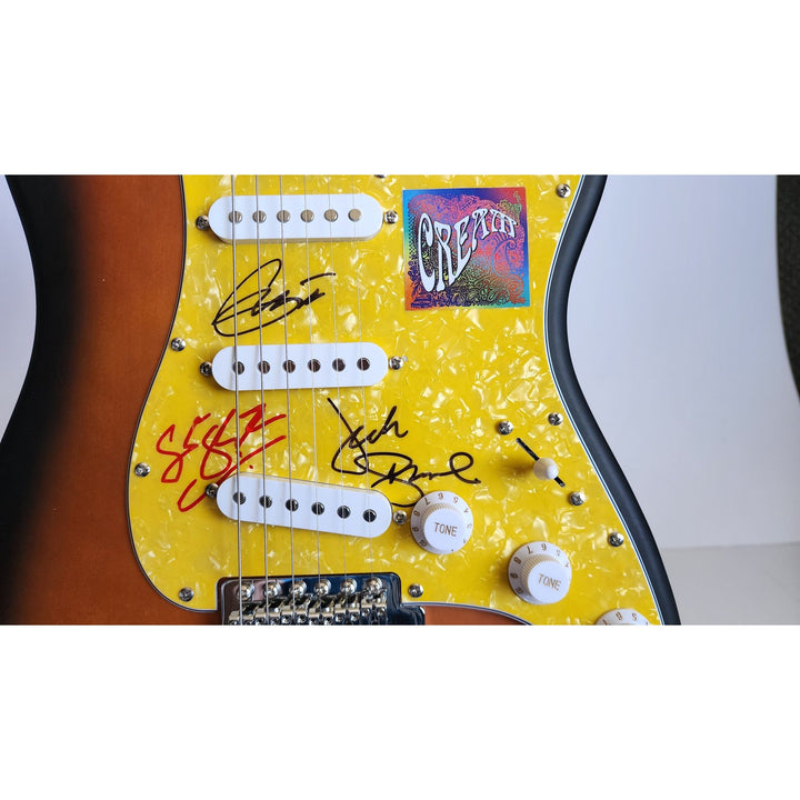 Cream, Eric Clapton, Ginger Baker, Jack Bruce, authentic Fender Stratocaster electric guitar signed with proof