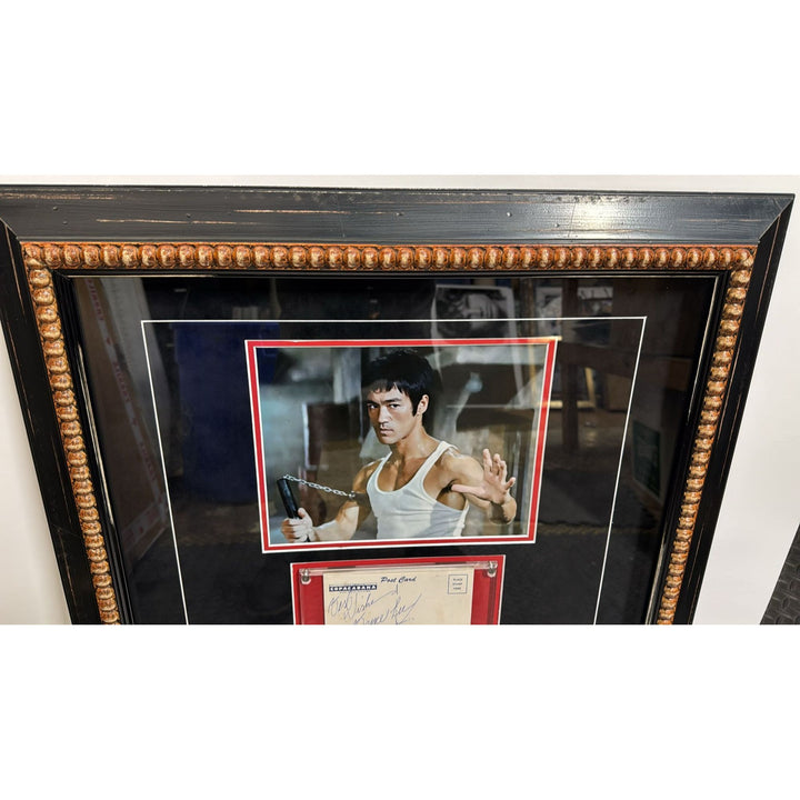 Bruce Lee a true icon in Martial Arts vintage postcard signed and inscribed with museum quality frame.