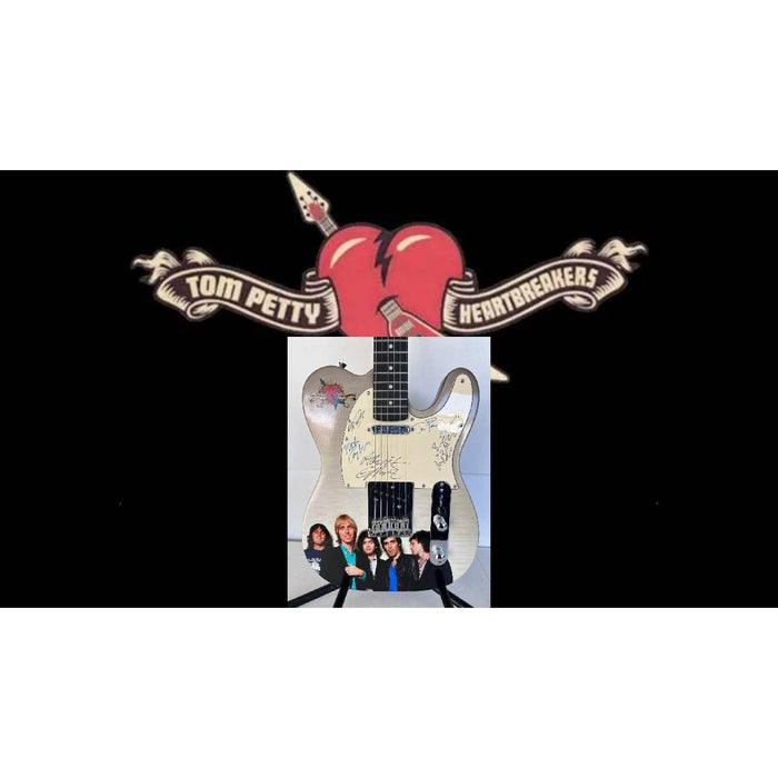 Tom Petty (with sketch) and The Heartbreakers, Ron Blair, Benmont Tench, Scott Thurston, and Mike Campbell full size electric guitar signed