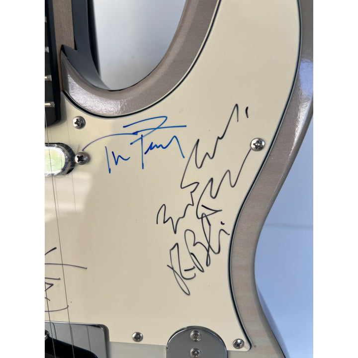 Tom Petty (with sketch) and The Heartbreakers, Ron Blair, Benmont Tench, Scott Thurston, and Mike Campbell full size electric guitar signed.