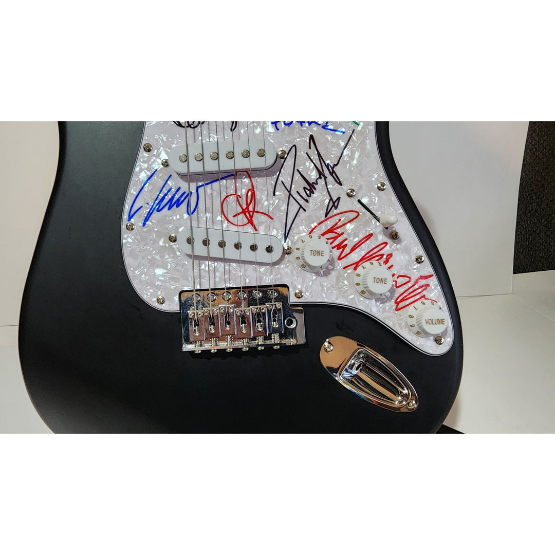Rammstein: Till Lindemann, Richard Z. Kruspe, Oliver Riedel, Paul Landers, Christian Lorenz & Christoph Schneider Fender Stratocaster signed with proof