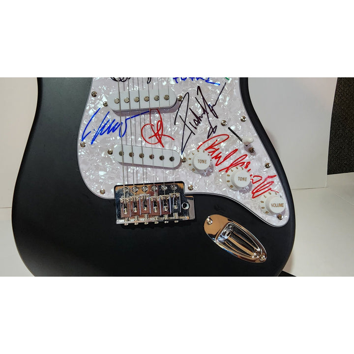 Rammstein: Till Lindemann, Richard Z. Kruspe, Oliver Riedel, Paul Landers, Christian Lorenz & Christoph Schneider Fender Stratocaster signed with proof