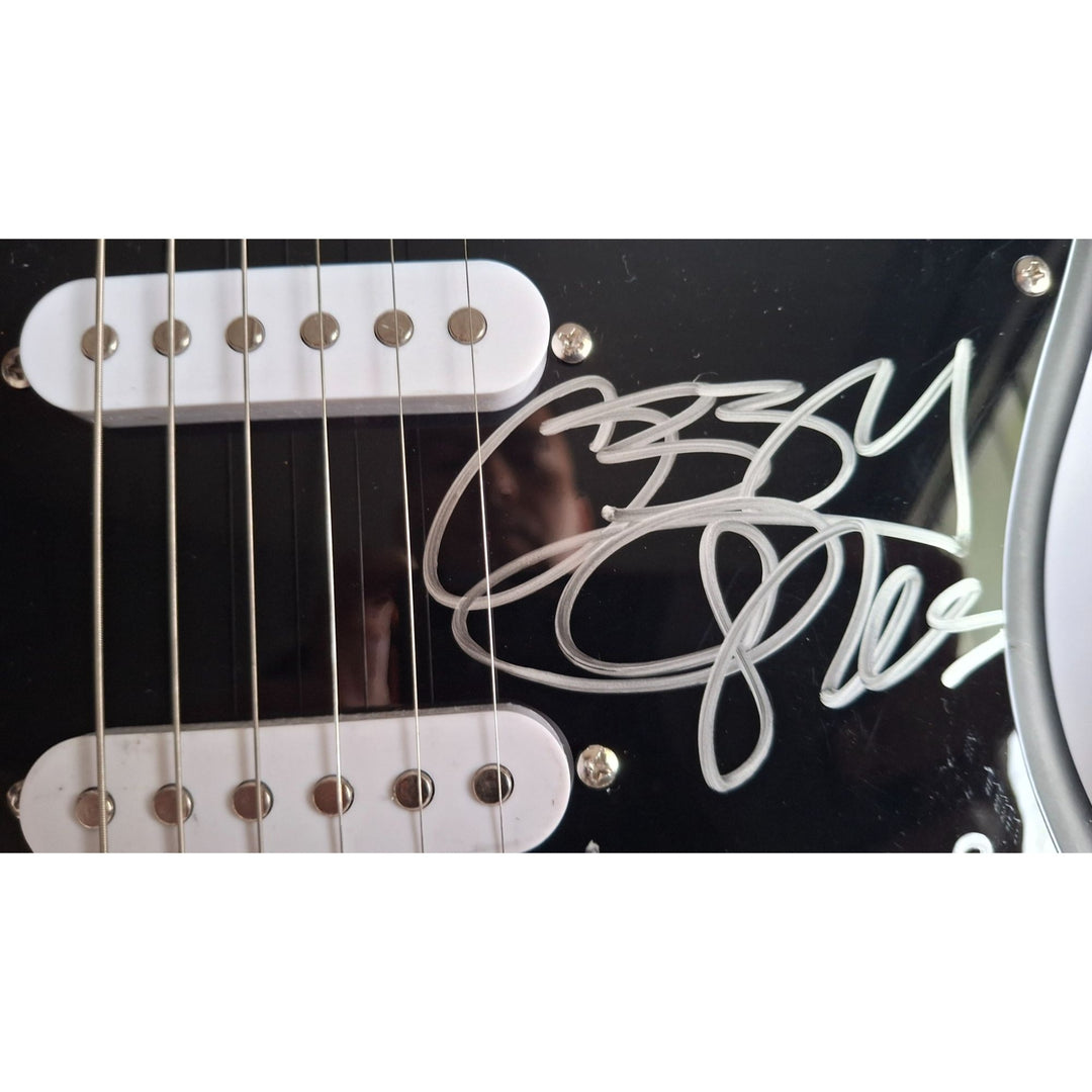 Ozzy Osbourne, Black Sabbath signed with inscription for Ronnie James Dio, Fender Stratocaster electric guitar signed with proof
