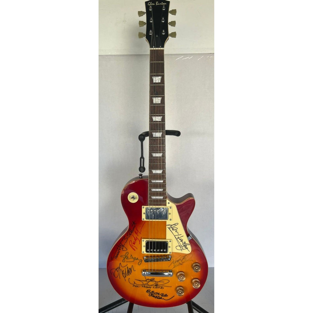 Bernie Leadon, Glenn Frey, Don Henley, Joe Walsh, Don Felder, Randy Meisner Timothy B. Schmit The Eagles Cherry Les Paul guitar signed.
