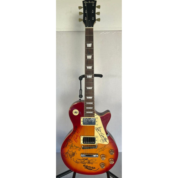 Bernie Leadon, Glenn Frey, Don Henley, Joe Walsh, Don Felder, Randy Meisner Timothy B. Schmit The Eagles Cherry Les Paul guitar signed.