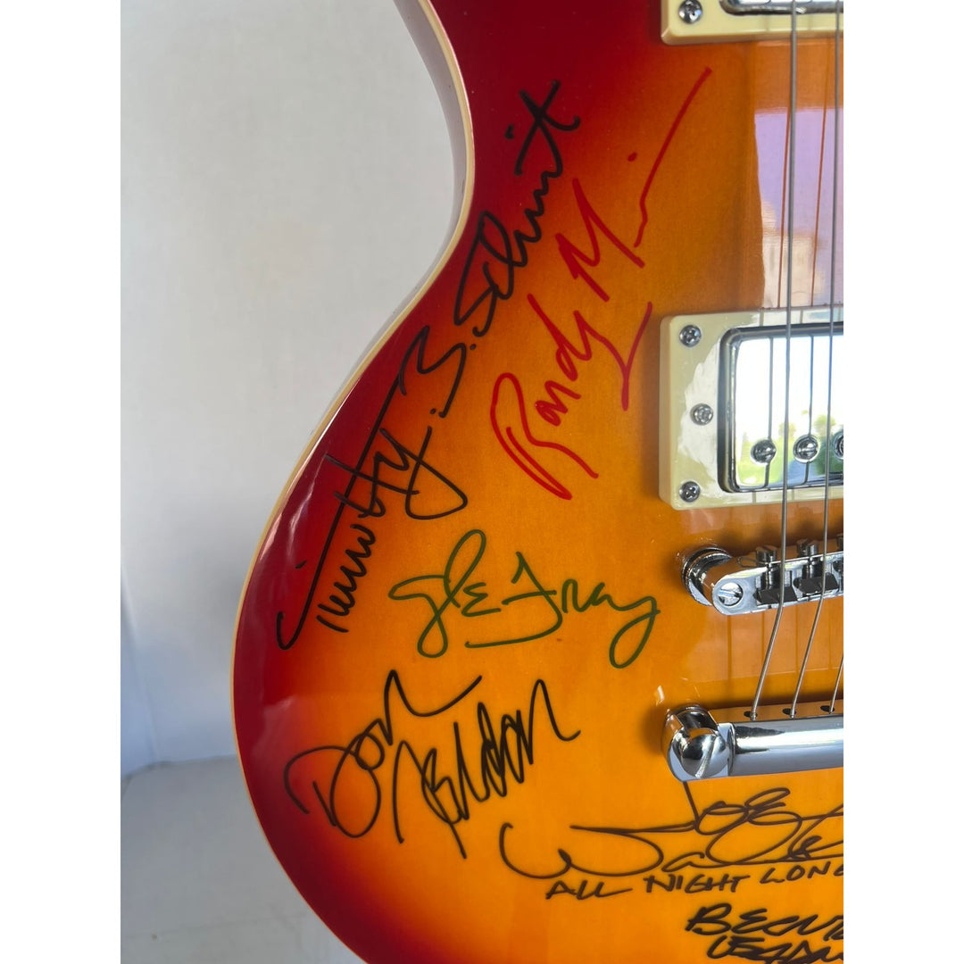 Bernie Leadon, Glenn Frey, Don Henley, Joe Walsh, Don Felder, Randy Meisner Timothy B. Schmit The Eagles Cherry Les Paul guitar signed.