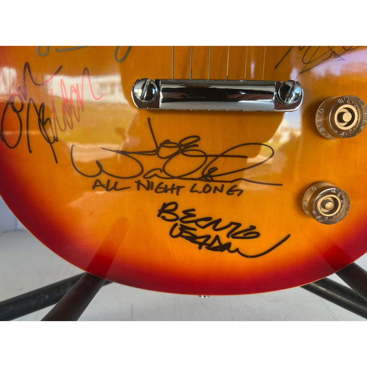 Bernie Leadon, Glenn Frey, Don Henley, Joe Walsh, Don Felder, Randy Meisner Timothy B. Schmit The Eagles Cherry Les Paul guitar signed.