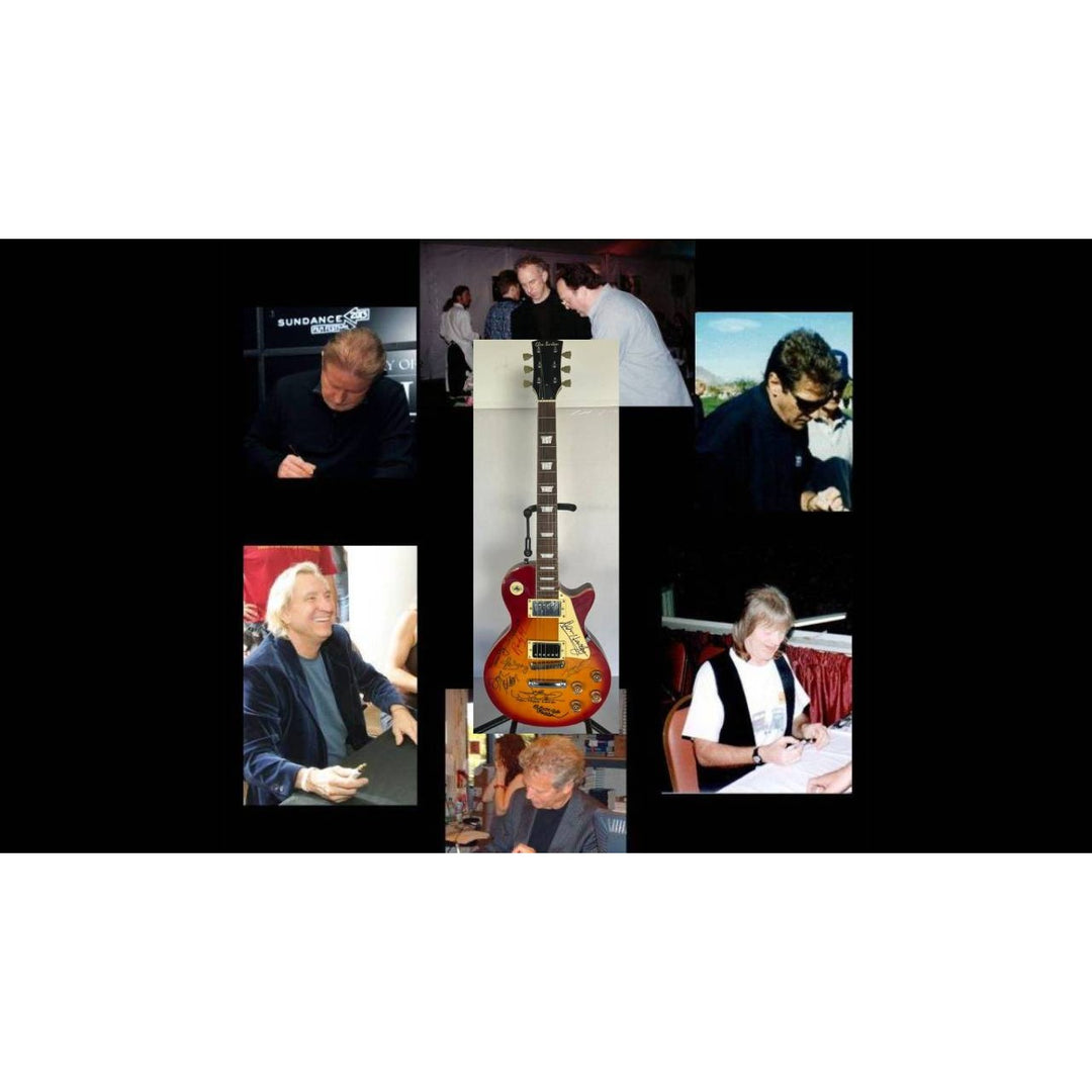 Bernie Leadon, Glenn Frey, Don Henley, Joe Walsh, Don Felder, Randy Meisner Timothy B. Schmit The Eagles Cherry Les Paul guitar signed.