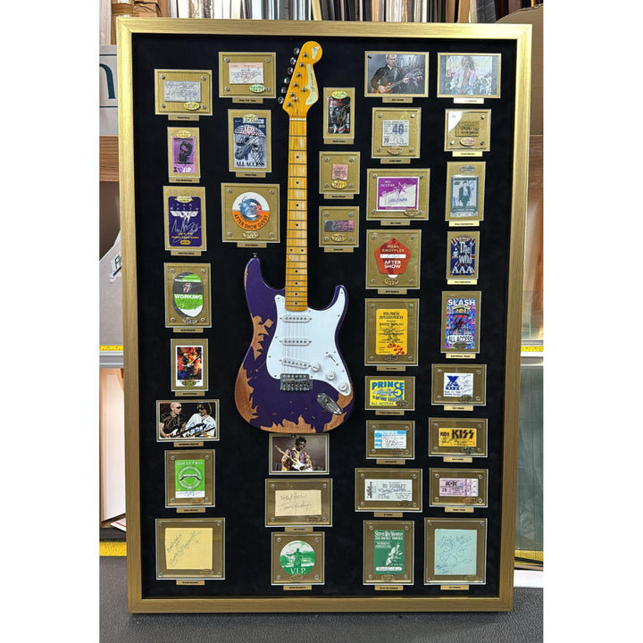 Jimi Hendrix, Stevie Ray Vaughan, George Harrison, 34 of Rock n Rolls greatest guitarists off all time with Jimi Hendrix guitar