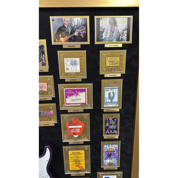 Jimi Hendrix, Stevie Ray Vaughan, George Harrison, 34 of Rock n Rolls greatest guitarists off all time with Jimi Hendrix guitar