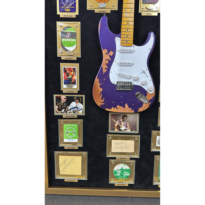 Jimi Hendrix, Stevie Ray Vaughan, George Harrison, 34 of Rock n Rolls greatest guitarists off all time with Jimi Hendrix guitar