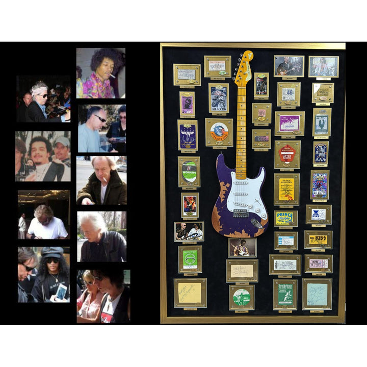 Jimi Hendrix, Stevie Ray Vaughan, George Harrison, 34 of Rock n Rolls greatest guitarists off all time with Jimi Hendrix guitar