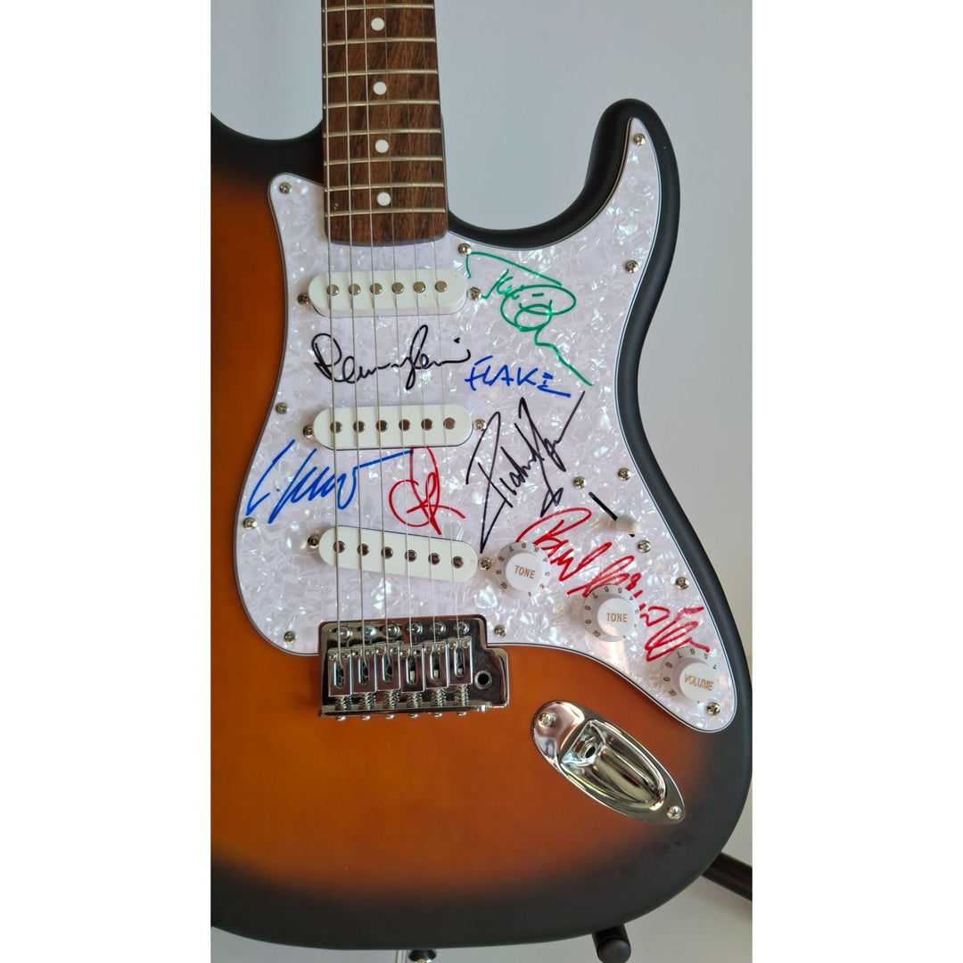 Rammstein: Richard Z. Kruspe, Till Lindemann, Oliver Riedel, Paul Landers, Christian Lorenz & Christoph Schneider Fender Stratocaster signed with proof