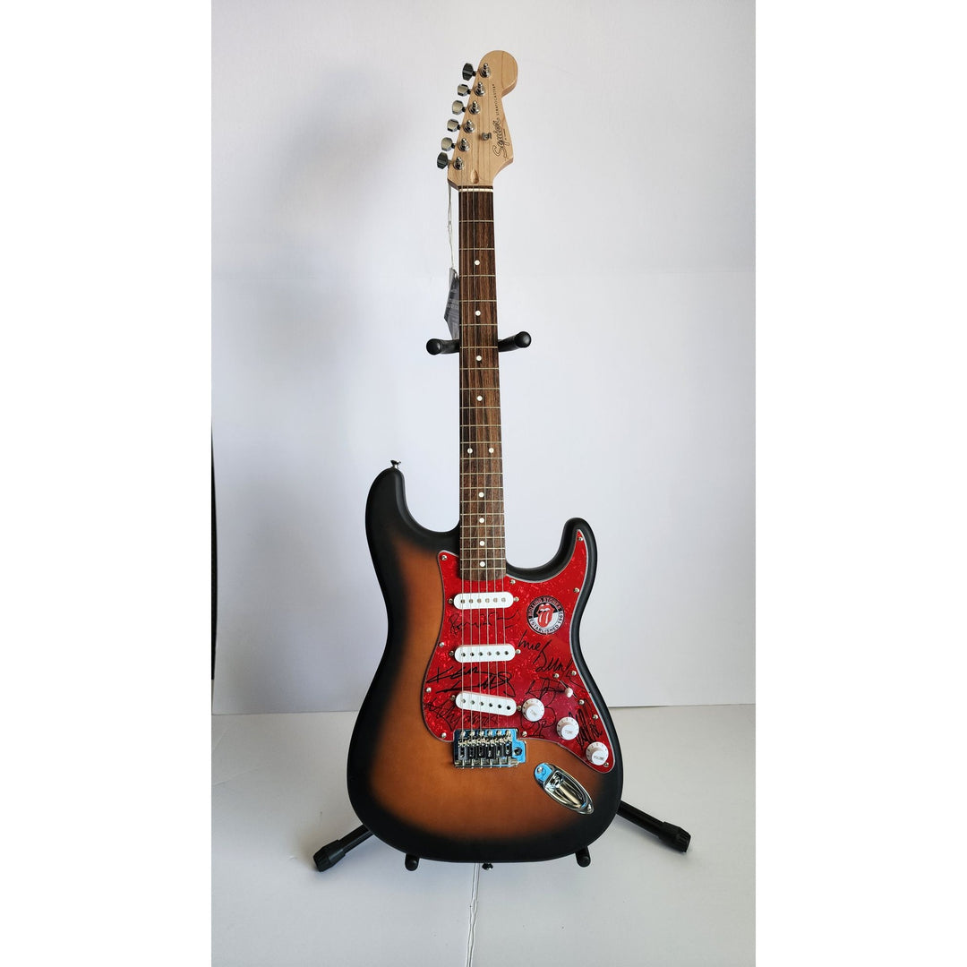 Mick Jagger, Keith Richards, Bill Wyman, Ronnie Wood, Mick Taylor, Charlie Watts Fender Stratocaster electric guitar signed with proof
