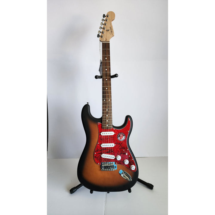 Mick Jagger, Keith Richards, Bill Wyman, Ronnie Wood, Mick Taylor, Charlie Watts Fender Stratocaster electric guitar signed with proof