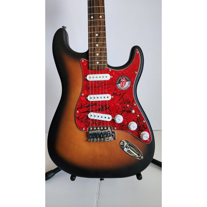 Mick Jagger, Keith Richards, Bill Wyman, Ronnie Wood, Mick Taylor, Charlie Watts Fender Stratocaster electric guitar signed with proof