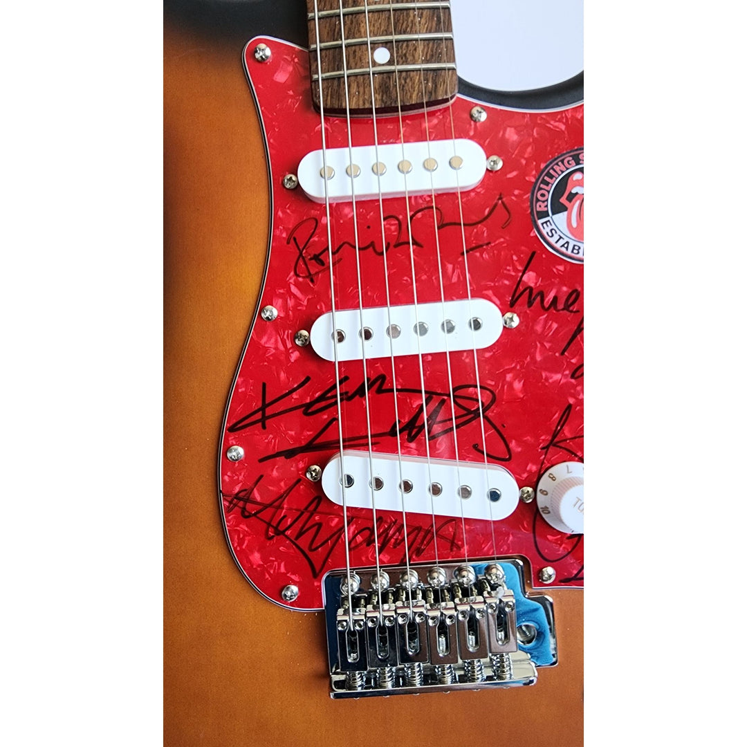 Mick Jagger, Keith Richards, Bill Wyman, Ronnie Wood, Mick Taylor, Charlie Watts Fender Stratocaster electric guitar signed with proof