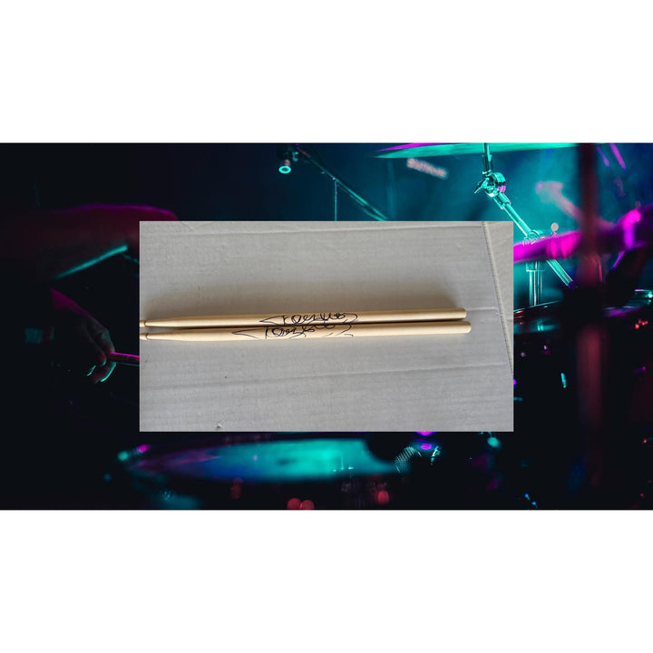 Tommy Lee of Motley Crue pair of drumsticks signed with proof.