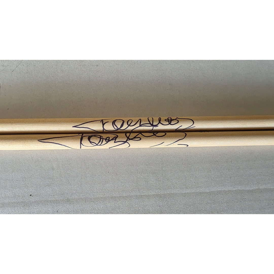 Tommy Lee of Motley Crue pair of drumsticks signed with proof.