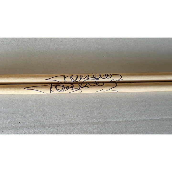 Tommy Lee of Motley Crue pair of drumsticks signed with proof.